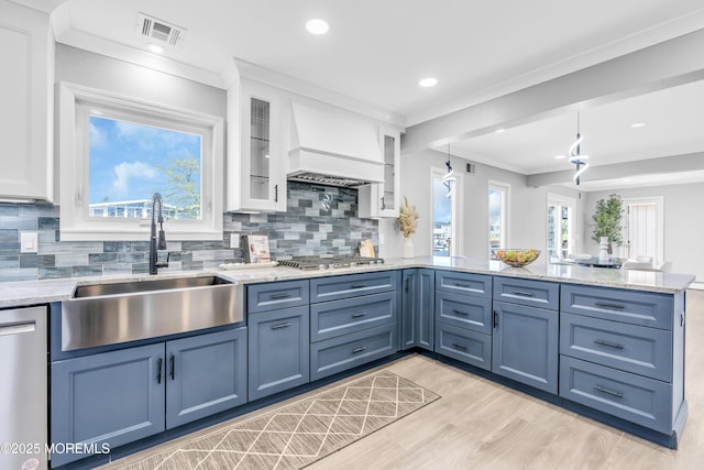 3 Toledo Dr, Brick, NJ 08723 - kitchen with a peninsula, appliances with stainless steel finishes, white cabinets, backsplash, and crown molding