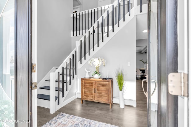 3 Toledo Dr, Brick, NJ 08723 - stairs with wood finished floors, a high ceiling, and a baseboard heating unit