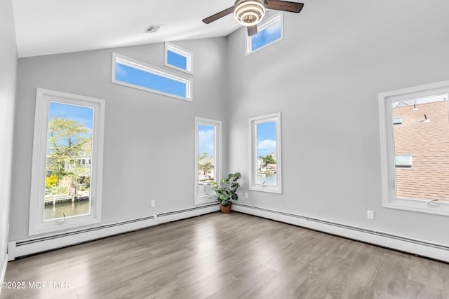 3 Toledo Dr, Brick, NJ 08723 - unfurnished room with ceiling fan, wood finished floors, a baseboard radiator, and high vaulted ceiling