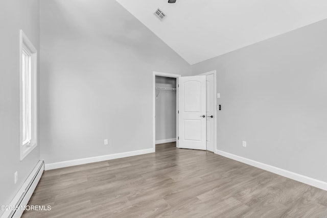 3 Toledo Dr, Brick, NJ 08723 - unfurnished bedroom featuring baseboard heating, high vaulted ceiling, light wood finished floors, and a closet