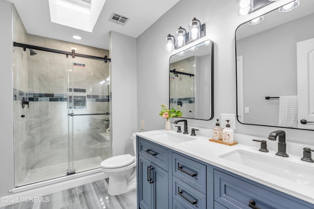 3 Toledo Dr, Brick, NJ 08723 - bathroom with a skylight, a stall shower, double vanity, and recessed lighting
