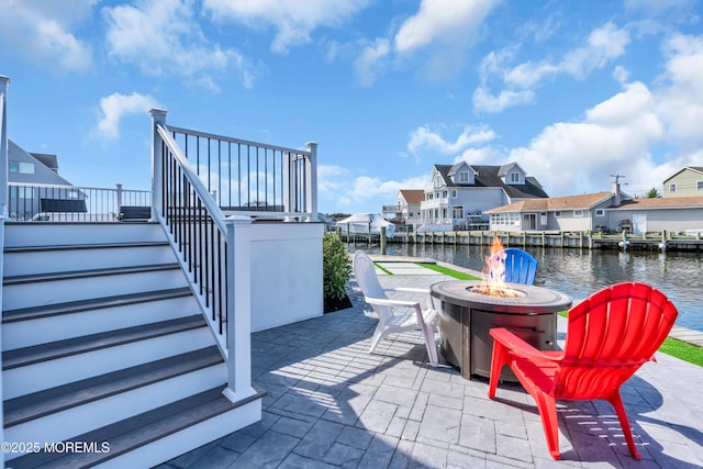 3 Toledo Dr, Brick, NJ 08723 - view of patio with an outdoor fire pit, stairs, a residential view, and a water view