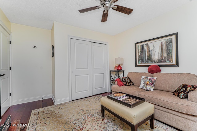 178 Loganberry Ln, Freehold, NJ 07728 - living room featuring wood finished floors, ceiling fan, baseboards, and a textured ceiling