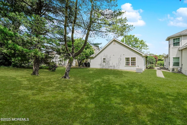 178 Loganberry Ln, Freehold, NJ 07728 - back of property with a yard and central AC unit