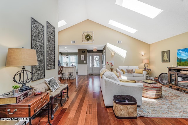 178 Loganberry Ln, Freehold, NJ 07728 - living room with a skylight, high vaulted ceiling, and wood finished floors