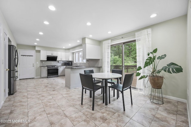 dining area featuring recessed lighting, light tile patterned floors, and baseboards
