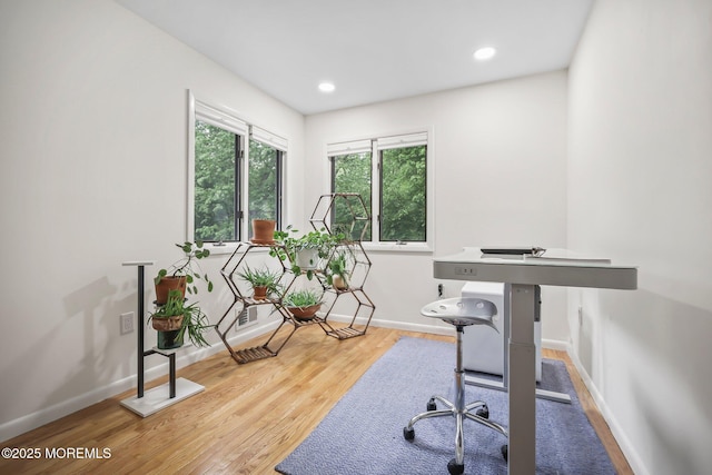 office with wood finished floors, baseboards, and recessed lighting