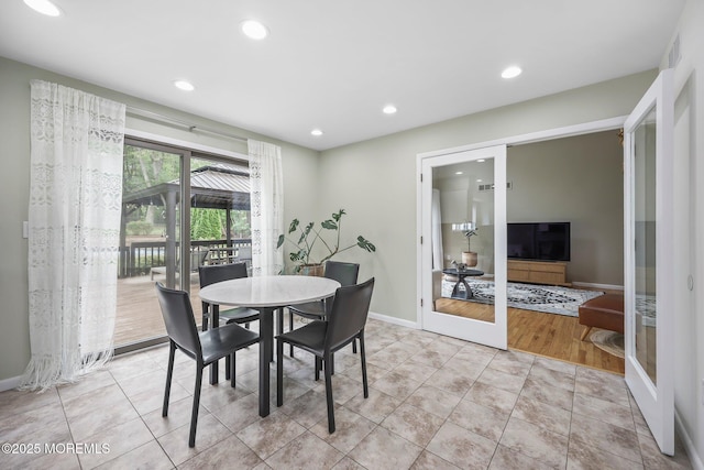 dining room featuring recessed lighting, baseboards, and light tile patterned flooring