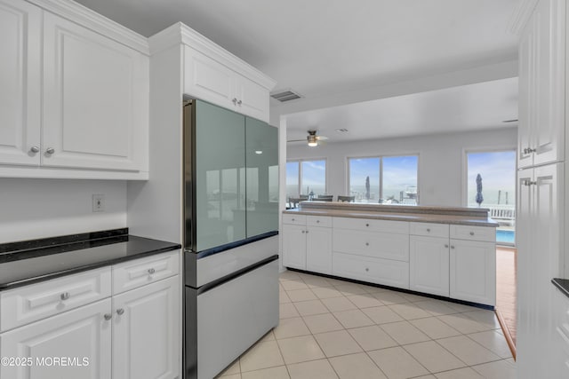 687 Princeton Ave, Brick, NJ 08724 - kitchen featuring white cabinets, ceiling fan, light tile patterned floors, and dark countertops