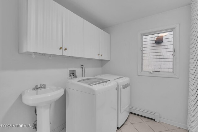 687 Princeton Ave, Brick, NJ 08724 - laundry area with a baseboard radiator, cabinet space, washing machine and clothes dryer, light tile patterned floors, and baseboards