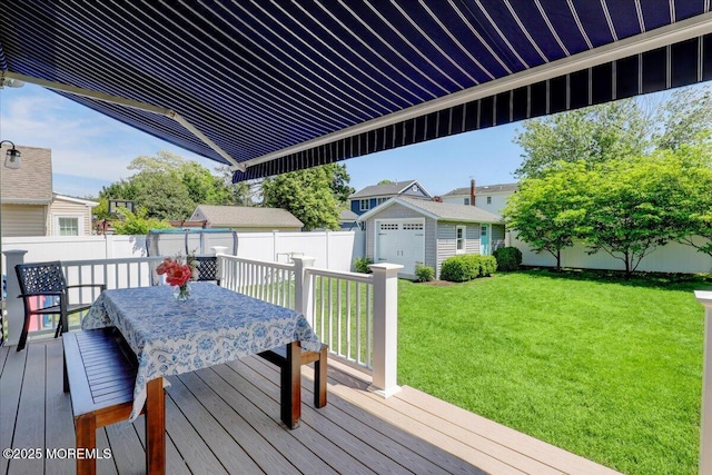 deck featuring outdoor dining area and an outdoor structure