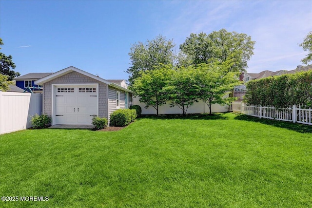 view of yard with a detached garage
