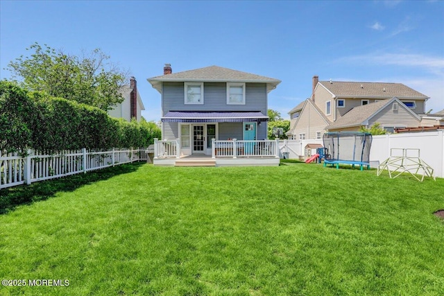 back of property featuring a wooden deck and a chimney