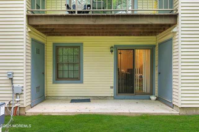 293 Gloucester Ct, Matawan, NJ 07747 - doorway to property with a balcony, central AC unit, and a patio area