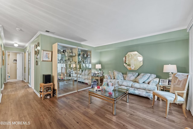 293 Gloucester Ct, Matawan, NJ 07747 - living room with crown molding, wood finished floors, and baseboards