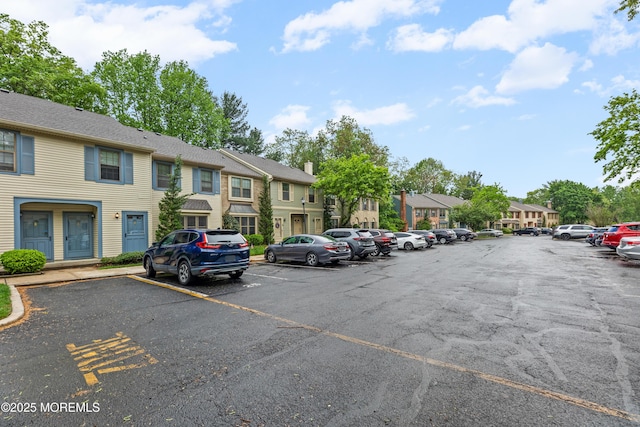 293 Gloucester Ct, Matawan, NJ 07747 - uncovered parking lot with a residential view