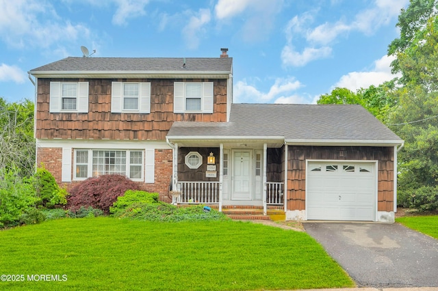 view of front of home with a chimney, a garage, a front yard, asphalt driveway, and a porch
