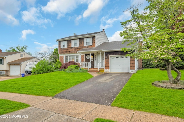 view of front of home featuring driveway, an attached garage, a front yard, and brick siding