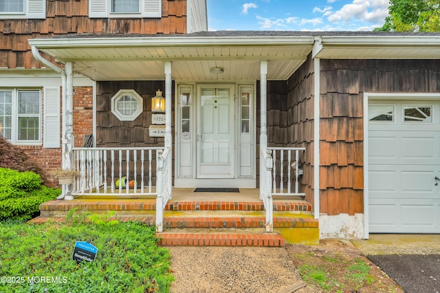 view of exterior entry featuring covered porch
