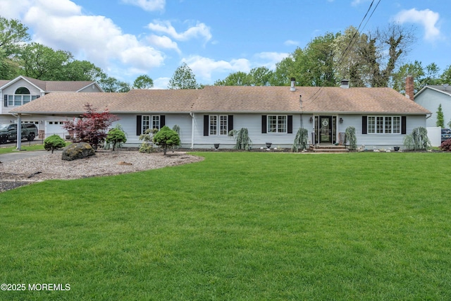 ranch-style home featuring a front lawn, a shingled roof, and a garage