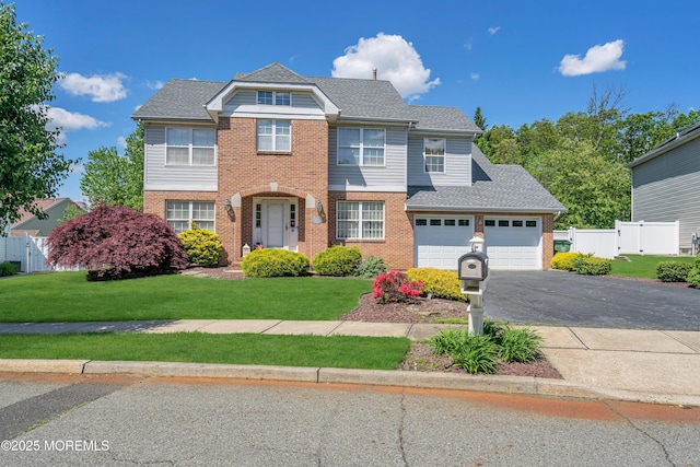 view of front of home featuring brick siding, asphalt driveway, and roof with shingles