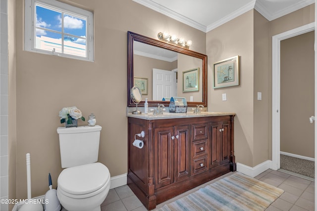 bathroom featuring tile patterned flooring, toilet, double vanity, ornamental molding, and baseboards