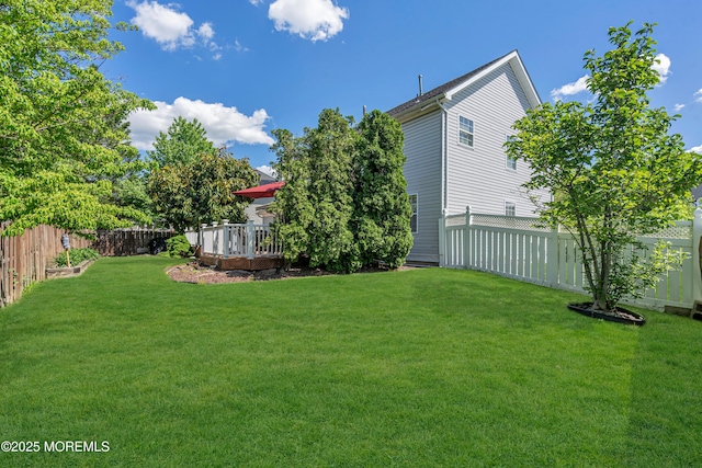 view of yard featuring a wooden deck