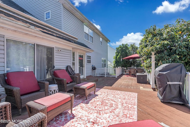 view of patio / terrace with a deck, grilling area, and an outdoor hangout area