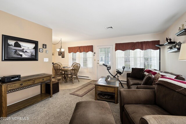 1154A Argyll Cir, Lakewood, NJ 08701 - living area with healthy amount of natural light, light carpet, a chandelier, and a baseboard radiator