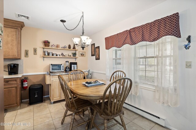 1154A Argyll Cir, Lakewood, NJ 08701 - dining room featuring a chandelier, light tile patterned flooring, and baseboard heating