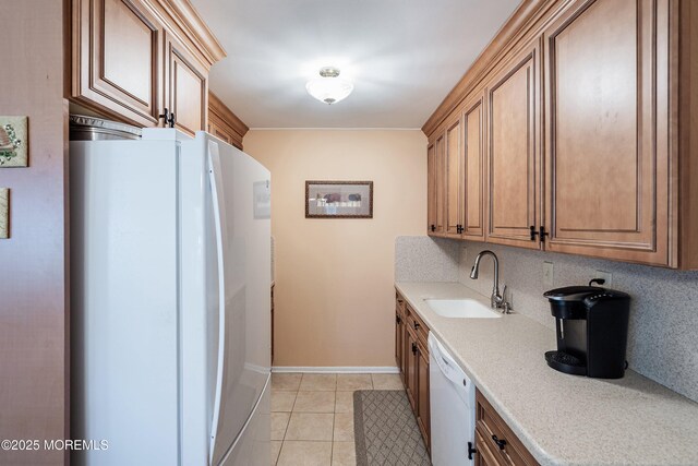 1154A Argyll Cir, Lakewood, NJ 08701 - kitchen with white appliances, a sink, light countertops, light tile patterned floors, and baseboards