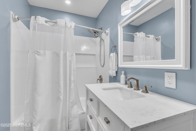 bathroom with shower / bath combo with shower curtain and vanity