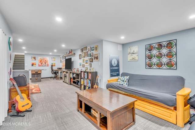 carpeted living area featuring stairs and recessed lighting