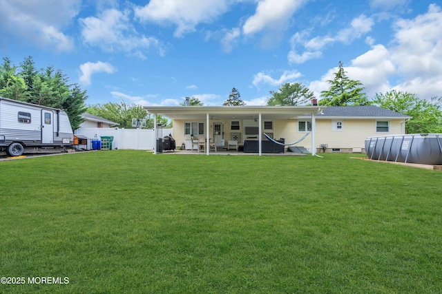 rear view of house with a patio