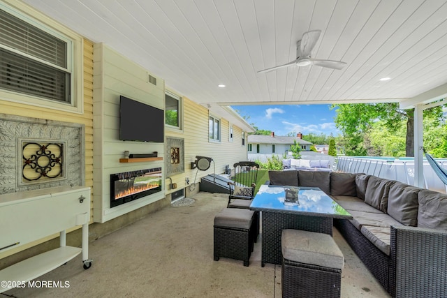 view of patio featuring an outdoor hangout area and a ceiling fan