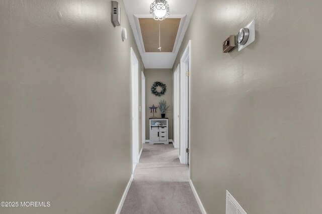 2465 Woodland Rd, Manchester, NJ 08759 - hall featuring attic access, light carpet, and baseboards