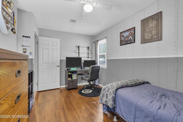 2465 Woodland Rd, Manchester, NJ 08759 - bedroom with wood finished floors, a desk, and a ceiling fan