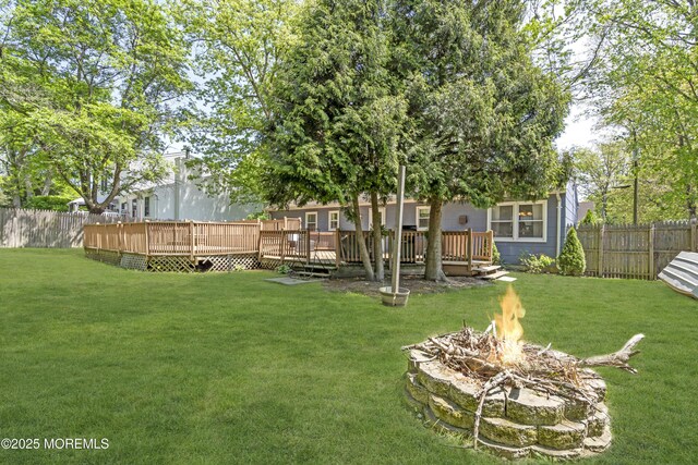 2465 Woodland Rd, Manchester, NJ 08759 - view of yard featuring an outdoor fire pit and a deck