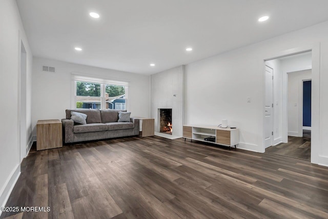 523 Norwood Ave, Long Branch, NJ 07740 - living room featuring a large fireplace, dark wood-style floors, baseboards, and recessed lighting