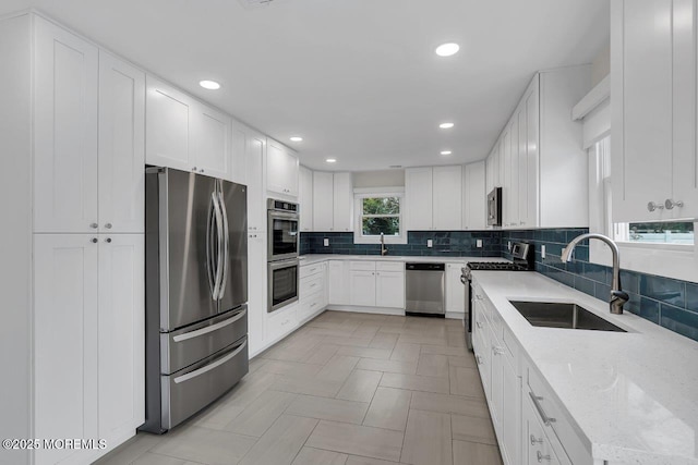 523 Norwood Ave, Long Branch, NJ 07740 - kitchen featuring stainless steel appliances, a sink, tasteful backsplash, recessed lighting, and white cabinets
