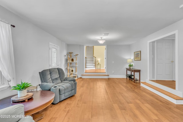 1042 Maxim Southard Rd, Howell, NJ 07731 - sitting room with light wood finished floors, stairs, and baseboards
