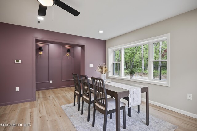 dining space with light wood-style flooring, a ceiling fan, baseboards, and recessed lighting