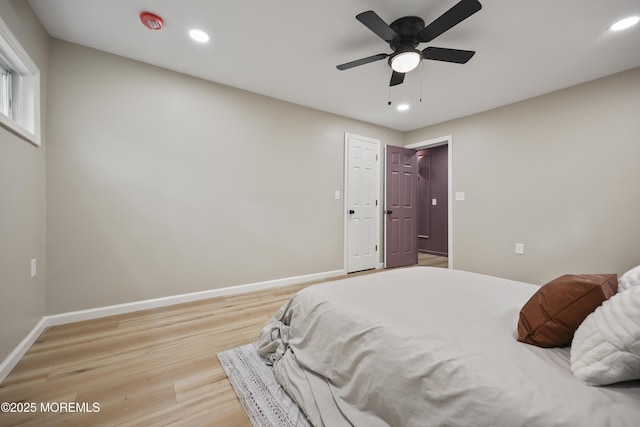bedroom featuring light wood-style flooring, recessed lighting, baseboards, and a ceiling fan