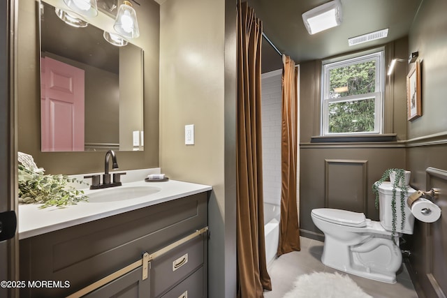 full bathroom with toilet, tile patterned flooring, vanity, and shower / bath combo