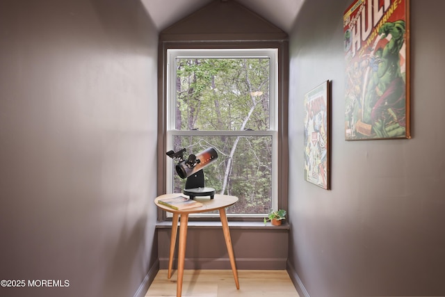 doorway to outside with light wood-style flooring and baseboards