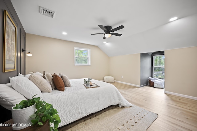 bedroom featuring wood finished floors, baseboards, multiple windows, recessed lighting, and a ceiling fan