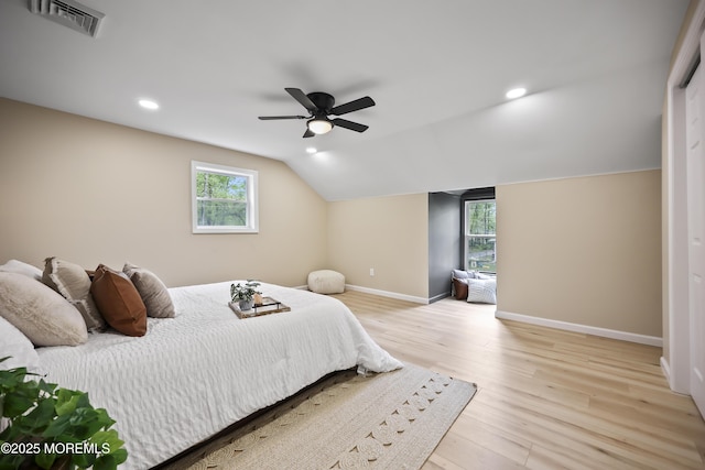 bedroom featuring light wood finished floors, baseboards, vaulted ceiling, recessed lighting, and a ceiling fan