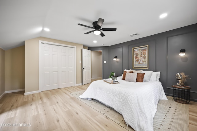 bedroom with light wood-style flooring, baseboards, a closet, recessed lighting, and a ceiling fan