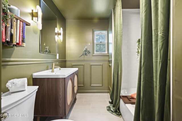 full bath featuring toilet, vanity, tile patterned floors, and shower / bath combination with curtain
