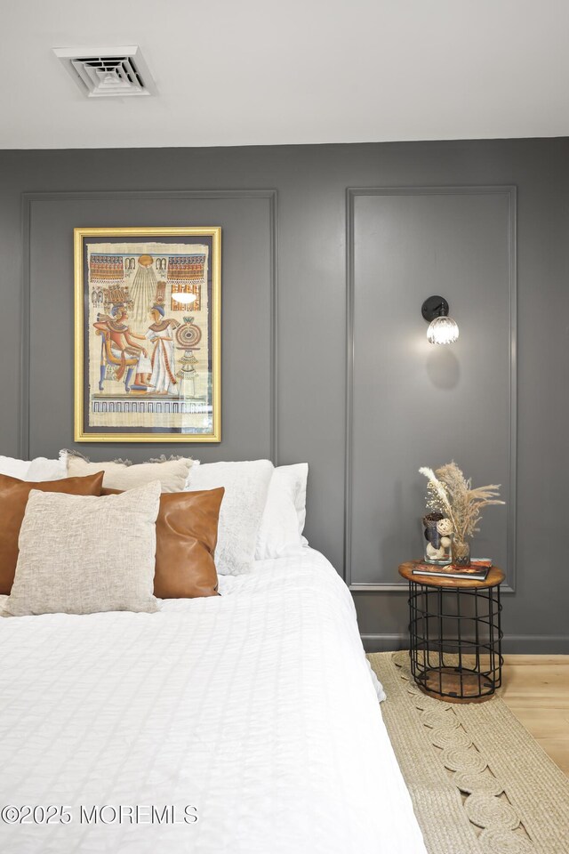 bedroom with wood finished floors
